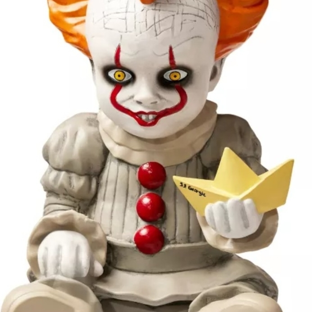 Creepy Clown Figurine with Red and Orange Accents